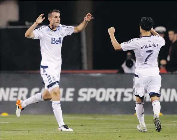  ?? — THE ASSOCIATED PRESS FILES ?? Whitecaps veteran Andrew Jacobson, left, who had eight goals in his previous 203 Major League Soccer games, has shown a surprising flair for offence since being used as an attacking central midfielder April 22 in a loss to the Portland Timbers.