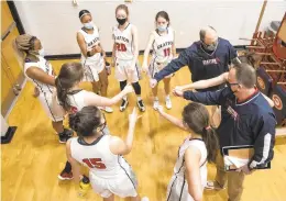  ?? HANNAH RUHOFF/STAFF ?? Grafton’s girls basketball team played its first game in its gym since a fire in early February, beating York 49-32 Thursday in a Bay Rivers District season opener.
