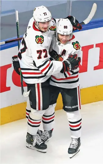  ?? GETTY IMAGES ?? Kirby Dach (left), celebratin­g his goal with Patrick Kane in Game 2 of the Blackhawks’ first-round series against the Golden Knights, plans to add weight and increase his mobility this offseason.