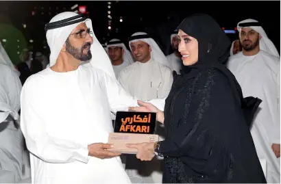  ?? — Photo by Juidin Bernarrd ?? Shaikh Mohammed bin Rashid presenting the Afkari Award for excellence in innovation to Shaikha Saif Al Rayehi at Emirates Tower, Dubai, on Thursday.