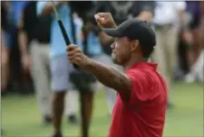  ??  ?? Tiger Woods celebrates after winning in Atlanta on Sunday. His victory has pumped even more buzz into the upcoming Ryder Cup. (AP Photo/John Amis)