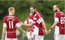  ??  ?? Brazilian flair Alex D’acol celebrates his goal with Ali Crawford (left) and Georgios Sarris