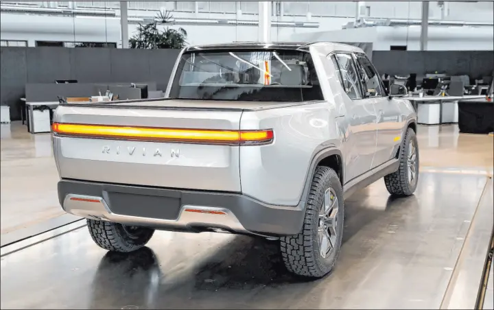  ?? Paul Sancya The Associated Press file ?? As shares in Rivian Automotive began to trade publicly on Wednesday, the world is getting a better idea of just how hot investors are for the electric vehicle market.
