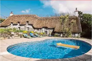  ??  ?? This three-bed house in Helston, Cornwall, comes with an outdoor swimming pool.