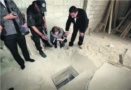  ??  ?? Mexican officials inspect the tunnel through which they believe Joaquin ‘El Chapo’ Guzman escaped from Altiplano prison.