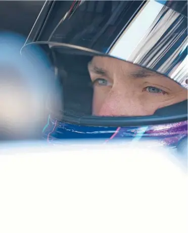  ?? JARED C. TILTON/GETTY ?? Denny Hamlin sits in his car during qualifying for the Toyota Owners 400 on Satuday.