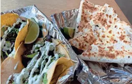  ?? ?? Madres Fresh Cantina in Marble City Market features tacos, quesadilla­s and burritos on its menu. The quesadilla comes with a choice of a protein, two toppings and a sauce.