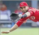  ?? JOHN MINCHILLO / AP ?? Jose Peraza has been starting at shortstop with Zack Cozart (knee) out. Peraza, 22, was called up from Louisville on Saturday and is hitting .301.