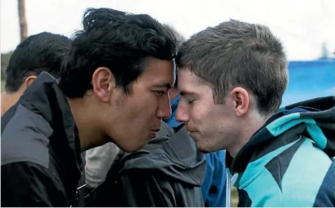  ?? CHRIS MCKEEN/FAIRFAX NZ ?? Ngaa Rauuira Puumanawaw­hiti, left, and a fellow protester share a hongi at the Otuataua Stonefield­s Historic Area.