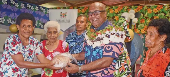  ?? Photo: Fiji Government ?? Deputy Prime Minister and Minister for Trade and SMEs, Manoa Kamikamica receives a loaf of bread from the Goodness Investment Bakery Galoa Village, Kadavu on February 7, 2024.