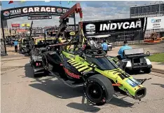  ?? AP ?? The car of driver Ed Jones is towed to the garage after a multipleca­r wreck at the beginning of yesterday’s IndyCar Series race at Texas Motor Speedway.