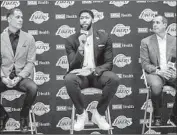  ?? Marcus Yam Los Angeles Times ?? ANTHONY DAVIS is introduced by Lakers general manager Rob Pelinka, left, and coach Frank Vogel.