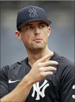  ?? ADAM HUNGER — THE ASSOCIATED PRESS ?? Yankees pitcher Clay Holmes speaks to a reporter on the field before Thursday’s doublehead­er against the Los Angeles Angels in New York.