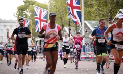  ?? ?? Runners approach the finish line of the 2022 London Marathon on the Mall. Photograph: David Cliff/AP