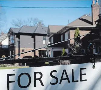  ?? GRAEME ROY THE CANADIAN PRESS ?? It’s not just a local problem: A “For Sale” sign adorns a street in Toronto, where sales were also down in March.