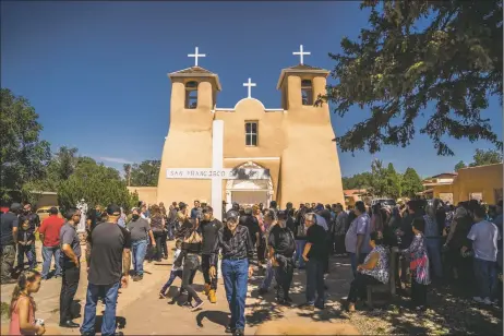  ?? NATHAN BURTON/Taos News ?? Hundreds gather to honor the life of Max Madrid at San Francisco de Asís Friday (Aug. 5).