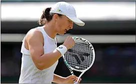  ?? KIRSTY WIGGLESWOR­TH / AP ?? Poland’s Iga Swiatek returns the ball to France’s Alize Cornet during a third round women’s singles match on day six of the Wimbledon tennis championsh­ips in London on Saturday.