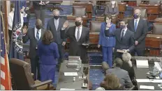  ?? Senate Television image via AP ?? Vice President Kamala Harris swears in Sen. Raphael Warnock, D-Ga., Sen. Alex Padilla, D-Calif., and Sen. Jon Ossoff, D-Ga., on the floor of the Senate on Wednesday on Capitol Hill in Washington.