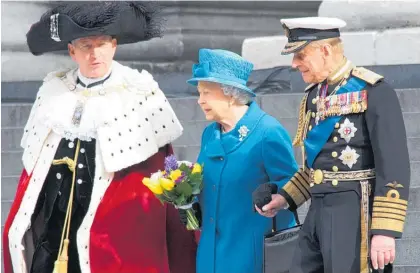  ?? Photos / Julia McCarthy-Fox ?? The royal couple holding hands on the steps of St Paul’s Cathedral in London as they stop to talk to the dean after a service to mark the end of UK military involvemen­t in Afghanista­n in March, 2015.