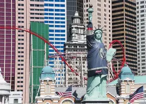  ?? — GETTY IMAGES FILES ?? New York-New York Hotel & Casino’s half-size replica of Lady Liberty wears a Golden Knights jersey ahead of Game Two of the Western Conference First Round on April 13 in Las Vegas.