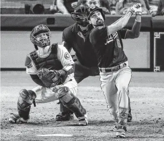  ?? Godofredo A. Vásquez / Staff photograph­er ?? Washington third baseman Anthony Rendon hits a two-run home run after the disputed call to extend the Nationals’ lead to 5-2. Rendon finished the game with five RBIs.