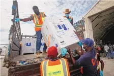  ?? FARAH ABDI WARSAMEH/ASSOCIATED PRESS ?? Boxes of the AstraZenec­a COVID-19 vaccine manufactur­ed by the Serum Institute of India and provided through the COVAX global initiative arrive at the airport in Mogadishu, Somalia, on March 15.