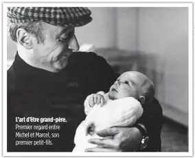  ??  ?? L’art d’être grand-père. Premier regard entre Michel et Marcel, son premier petit-fils.