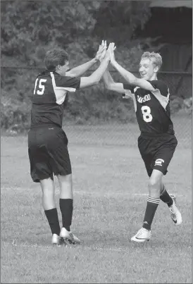  ??  ?? Oakwood Christian’s John-Jacob McSpadden (15) celebrates with Andrew Phillips (8) after Phillips found the net in a recent home match against Apostolic School of Knoxville. The Eagles were scheduled to play in the SCAA tournament on Monday, but details...