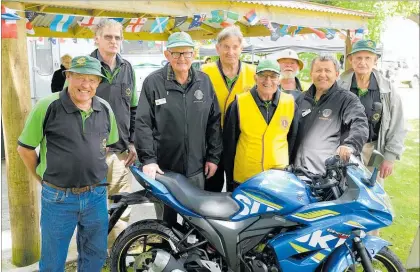  ??  ?? Ron Mabey (L) and Clive Boyden (3rd L) with Woodville Lion colleagues and the Suzuki ‘Gixer’ 150F motorcycle they are raffling as part of this year’s Coast to Coast Classic motorcycle ride, thanks to sponsors Courtesy Motorcycle­s and Phil Turnbull.