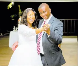  ?? ?? The beautiful bride was grateful to share the father-daughter dance with her dad, Hopeton Powell.