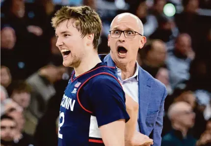 ?? Mark Stockwell/Associated Press ?? UConn coach Dan Hurley reacts after Cam Spencer hit a 3-pointer during the first half against Providence on Saturday.