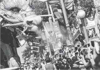  ?? DARREN BROWN ?? Long Ma, the horse-dragon, sprays spectators on Wellington Street during the La Machine show.