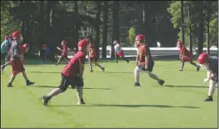  ?? The Sentinel-Record/Richard Rasmussen ?? PRACTICE TIME: Football players at Mountain Pine run through drills during the first day of practice Monday.