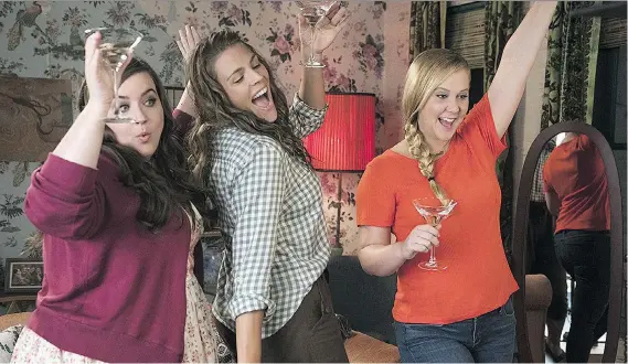  ?? STXFILMS ?? Amy Schumer, right, seen with Aidy Bryant, left, and Busy Philipps, returns to the big screen in I Feel Pretty. Schumer gains a new sense of confidence following a head injury.