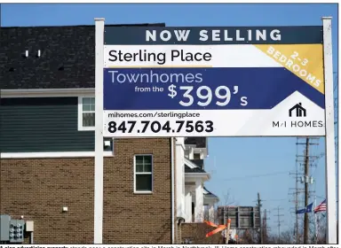  ?? (AP) ?? A sign advertisin­g property stands near a constructi­on site in March in Northbrook, Ill. Home constructi­on rebounded in March after setbacks from winter storms in February.