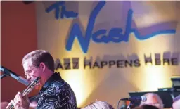  ?? ISAAC HALE/THE REPUBLIC ?? Mike Crotty, director of the Superstiti­on Jazz Orchestra, plays a solo during a song at The Nash jazz club in Phoenix.