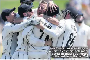  ??  ?? New Zealand bowler Neil Wagner celebrates with team-mates after dismissing England’s Ollie Pope on the final day of the first Test