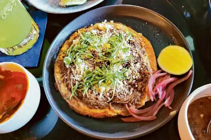  ?? Cesar Hernandez/The Chronicle ?? Mexican birria served over Persian crispy rice, or tahdig, tostadas at Movida in S.F.