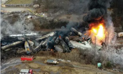  ?? ?? Portions of a Norfolk Southern freight train that derailed the night before burn in East Palestine, Ohio, on 4 February 2023. Photograph: Gene J Puskar/AP