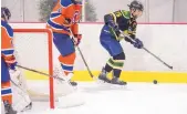  ??  ?? Hilltopper­s’ captain Ben Rees circles behind the Amarillo net looking for an opening.