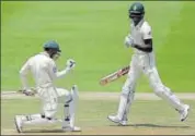  ?? AP ?? South Africa's Quinton de Kock (left) celebrates his fourth Test century with Kagiso Rabada, at the Wanderers against Pakistan.