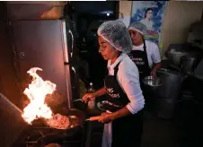  ?? ?? Anita Clemente, president of the ‘La Amistad’ soup kitchen in Lurin in southern Lima, prepares food using the peels, leaves, and stems of vegetables and fruits using culinary techniques to optimize food at the Maria Parado de Bellido soup kitchen in Villa el Salvador, on the southern outskirts of Lima.