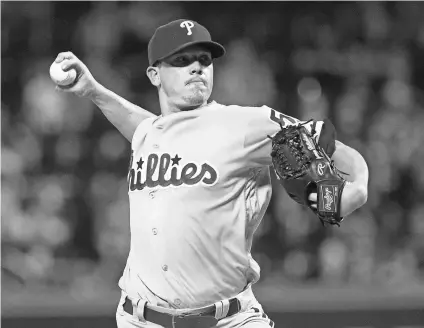  ?? BILL STREICHER, USA TODAY SPORTS ?? Jeremy Hellickson opted to stay with the Phillies, accepting their $17.2 million qualifying offer.