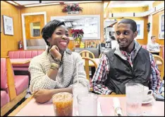  ??  ?? Janelle Jones shares a smile with her boyfriend, Alexander Gothard, at White House Restaurant in Buckhead. For Jones, the moment of truth in this year’s election came one evening in mid-August, and she was backing Donald Trump for president and doing...