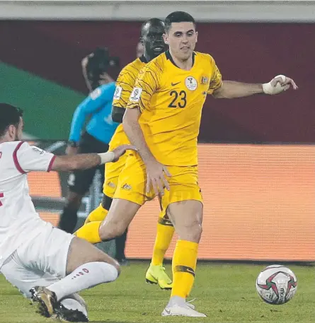  ??  ?? MATCH WINNER: Australia's midfielder Tomas Rogic duels for the ball with Syria's midfielder Tamer Haj Mohamad.