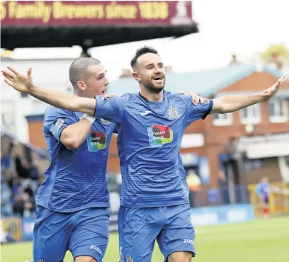  ?? Www.mphotograp­hic.co.uk ?? ●●Matty Warburton celebrates his goal with Frank Mulhern, left