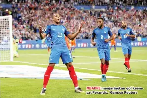  ??  ?? MBAPPE menjaringk­an gol keempat Perancis. -Gambar Reuters