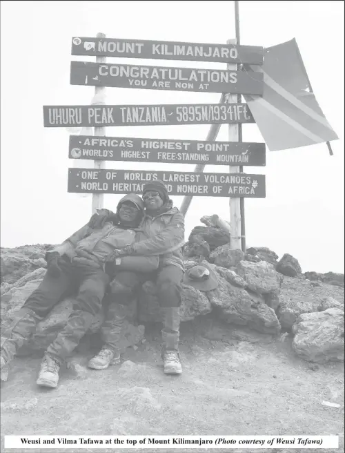  ?? (Photo courtesy of Weusi Tafawa) ?? Weusi and Vilma Tafawa at the top of Mount Kilimanjar­o