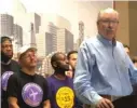  ?? FRAN SPIELMAN/SUN-TIMES ?? Tom Balanoff, president of SEIU Local 1, joins O’Hare Airport employees on Wednesday to announce union contracts for 2,200 employees of Scrub, Inc. and Prospect Airport Services.