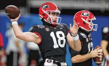  ?? CURTIS COMPTON/ CURTIS. COMPTON@ AJC. COM ?? In four games as Georgia’s starting quarterbac­k, JT Daniels, a 6- foot- 3, 210- pound transfer from USC, went 4- 0, completing 67% of his passes for 1,231 yards and 10 touchdowns and only two intercepti­ons.